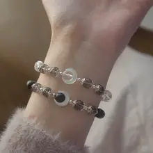 月の光と影を感じるオニキスとホワイトクリスタル のカップル用ブレスレット【シンプルデザイン・マザーオブパール使用】