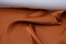 薄手の光沢感あるキャラメルオレンジパールサテン生地【シャツ・漢服用】