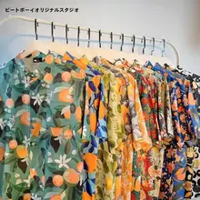 リゾート風フルーツオレンジプリントの短袖シャツ【ユニセックス・ルーズフィット・夏用】