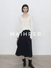 春のデザイン感満載！バックリボン付きの長袖透け感トップス