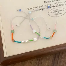 カラフルなビーズが魅力の編み込みブレスレット【可愛らしいデザイン・エスニックスタイル・多色使い】（セットアップ対応）