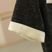 気品あるゆったりシルエットのワンピース【半袖・黒・細見え効果】