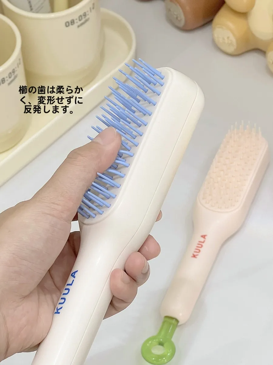 携帯可能な伸縮ミニブラシ：頭皮マッサージと静電気防止の女性向けケアツール