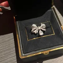 Joy 蝶結びデザインの水滴型リング【立体ラメ・軽やかで華やか】