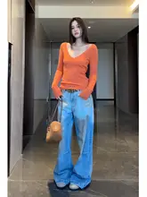 オレンジのVネックニットセーター【レトロなツイストデザイン・スリムフィット・長袖】