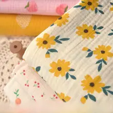 リーフとイエローフラワー柄の泡泡二重棉生地【ドレスや子供服の製作に最適】