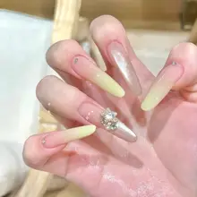 猫目デザインの美しいロングネイル【クリーミイイエロー・手作り・華やかな雰囲気】