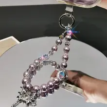 おしゃれなデザイン！パールと雪の結晶モチーフのスマホストラップ【短め・防失防止・ハンドアクセサリー】