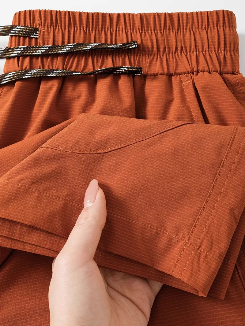 夏のショーツで暑さをどうにかする？オレンジ色の速乾ショートパンツが救うリアルな使い方