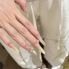 猫目デザインの美しいロングネイル【クリーミイイエロー・手作り・華やかな雰囲気】