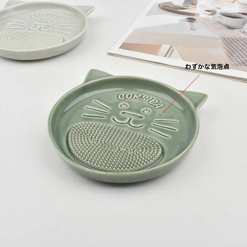 陶製猫デザインの生姜おろし器：手動タイプで家庭キッチンで実用的な研磨機能を実現