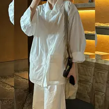 シンプルで洗練されたデザインの白シ ャツとワイドパンツ【ゆったりした大きいサイズ・通勤用・春向け】（セットアップ対応）