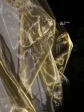 透け感のある金色のオーガンザ生地【華やかなウェディングドレス・和服・子供服デザインに最適】