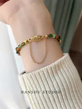 四葉クローバーデザインのヴィンテージ風ブレスレット【チェコ製ガラスビーズ・女性用】