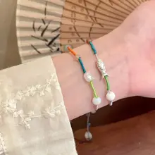カラフルなビーズが魅力の編み込みブレスレット【可愛らしいデザイン・エスニックスタイル・多色使い】（セットアップ対応）