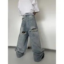 穴の開いたデニムパンツ バギー ストリ ート感 ウォッシュブルー 破壊加工