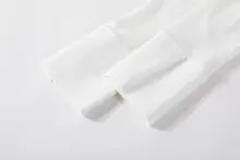 トレンド感ある白色ニットカーディガン【長袖・春秋用・レイヤードスタイル】