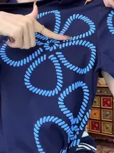 女性用 ゆったりとしたデザインのプリント半袖Tシャツ【スタイリッシュ・普段使いに最適・スリム効果】