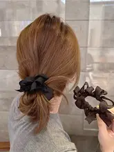 ハンドメイドの蝶結びヘアゴム【デザイナー作品・編み込み】【大人可愛い】