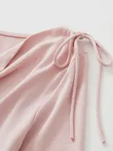 春らしい粉色の長袖Tシャツ【リボン付き・ウエストシェイプ・女性用】
