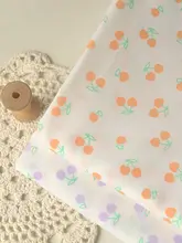 黄紫色のさくらんぼ柄のコットン生地【手作り・洋服・テーブルクロス・DIY用】