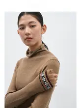 デザイン性の高いタートルネックニットセーター【民族風・流れるフリンジ・女性用】