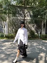 個性的なデザインのアシンメトリック波型ドット切替黒ロングスカート（セットアップ対応）