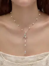 洗練されたデザイン！ひなぎくモチーフの流れるネックレス【サターンデザイン・女性用・トップスに最適】