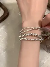 シンプルデザインの銀色ビーズエラスティックブレスレット【高級感ある手元を演出】