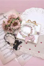 可愛い二重リボンデザインのパールビーズブレスレット【水晶装飾・女の子向け】