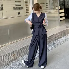 おしゃれで洗練された女性用のコーディネート【フェイク2ピース・ジョイントトップス・ハイウエストワイドパンツ】（セットアップ対応）