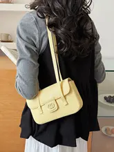 洗練されたデザインのPU製ハンドバッグ【日光黄・枕頭型・軽量】