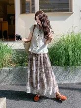 几何学模様のハイウエストスカートとベストの2点コーディネート（セットアップ対応）
