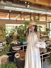 トレンド感あふれるデザインのロングキャミワンピース【肩出し・リボン付き・フレアシルエット】