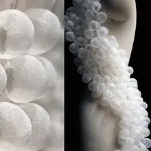 白色泡泡素材の立体的なレースデザイン布地【透視感・褶皱加工】