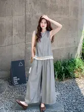 グレーの流れるフリンジ付きキャミソールとしたワイドパンツのコーディネート（セットアップ対応）