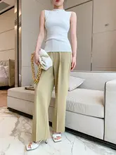 女性用の白いワイドレッグパンツ、ハイウエストでドレープのあるフロアレングスパンツ