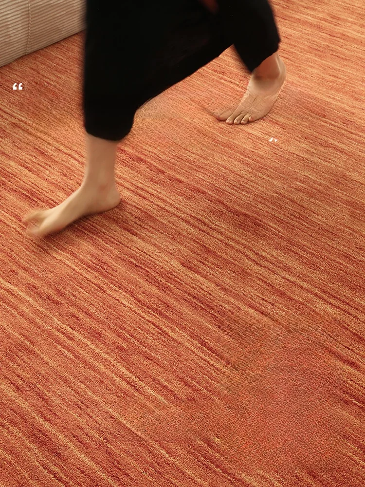 ピンクオレンジの純羊毛ラグ：現代輕奢風リビング用の高吸音性と防滑性能を実証