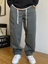 カジュアルなデザインのカーキ色ワークパンツ【ストレート・ゆったり・コットン製】