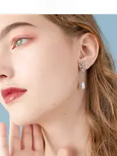 花のデザインが魅力的な水滴型クリスタルイヤリング【トレンド・流れるタッセル・穴あけ不要】