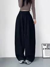 ブラックのフィットワイドレッグパンツ【春季用・カジュアルスタイル・フロアロング】