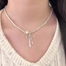 美しいリボンデザインのパールネックレス【鎖骨チェーン・春夏用・高級感あり】