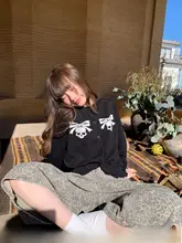 デザイン性のあるゆったりニットカーディガン【春用・リボン付き・スカル柄】