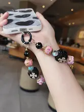 豪華な水晶ディテールの幸運花モチーフのカメラストラップ【手作り・ビーズチェーン・デザイン性高い】