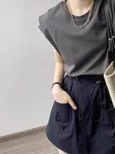 白色のショートスリーブTシャツ 女性 夏季 フィッティングスタイル ゆったり 多用途 ノースリーブ キャミソール 小さなフリル