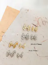 立体リボンデザインの金属製ネイル装飾品【シルバー・ストーン付き】