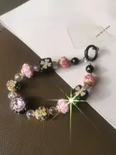 豪華な水晶ディテールの幸運花モチーフのカメラストラップ【手作り・ビーズチェーン・デザイン性高い】