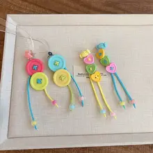 春夏にぴったり！カラフルなボタンのロングフリンジピアス【可愛いデザイン・上品な雰囲気】