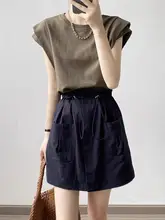 白色のショートスリーブTシャツ 女性 夏季 フィッティングスタイル ゆったり 多用途 ノースリーブ キャミソール 小さなフリル