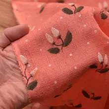 オレンジ色のダイヤ柄ポリエステルコットン生地【花柄プリント・シャツドレスや旗袍、手作り卓上布に最適】